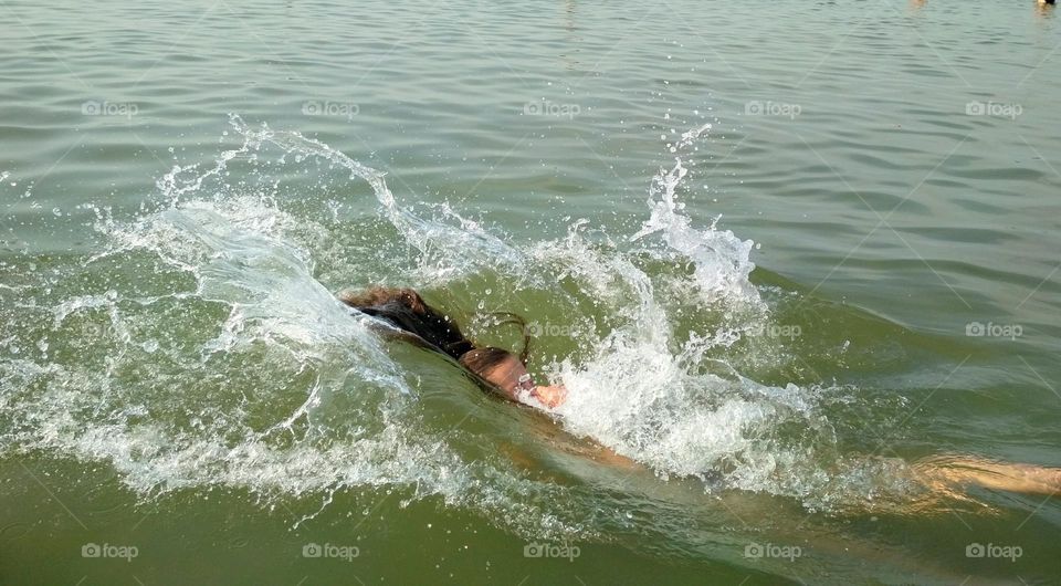 Woman diving in the water