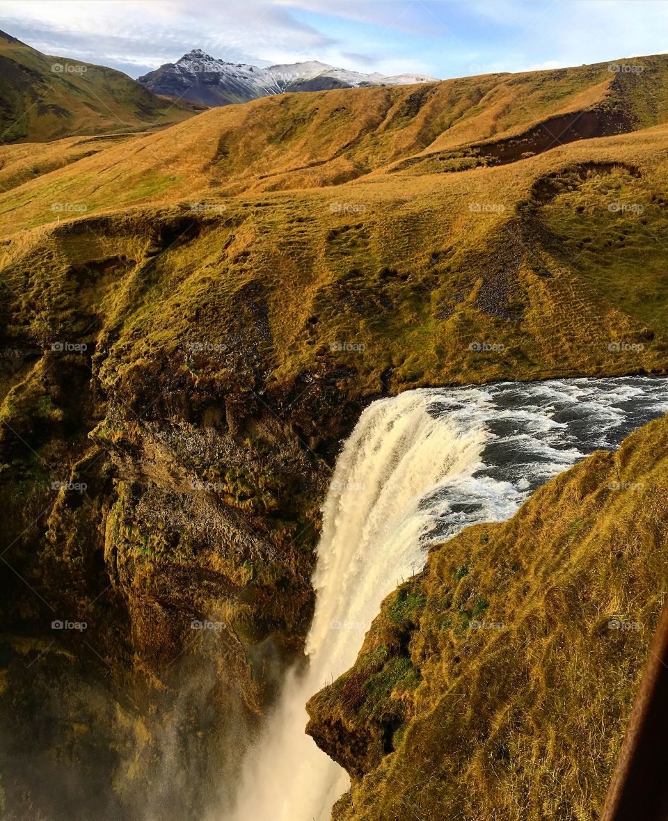 Standing over a waterfall, Iceland beauty in  autumn 