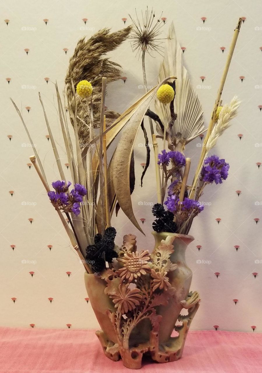 Dried Arrangement In A Hand Carved Stone Vase