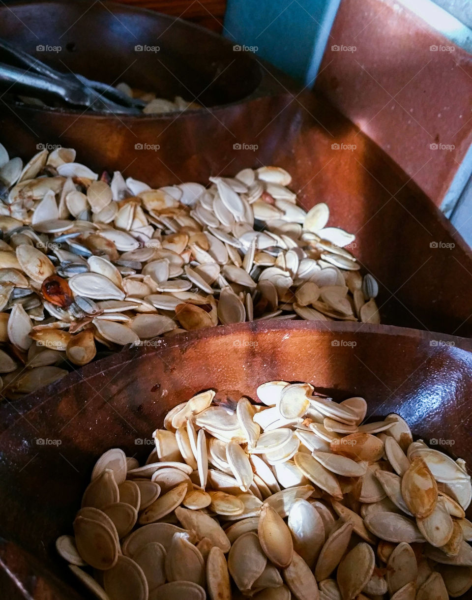 Roasted Pumpkin Seeds in a wooden bowl