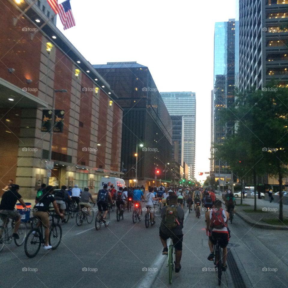 City Cyclists. Group of cyclists riding in a downtown city