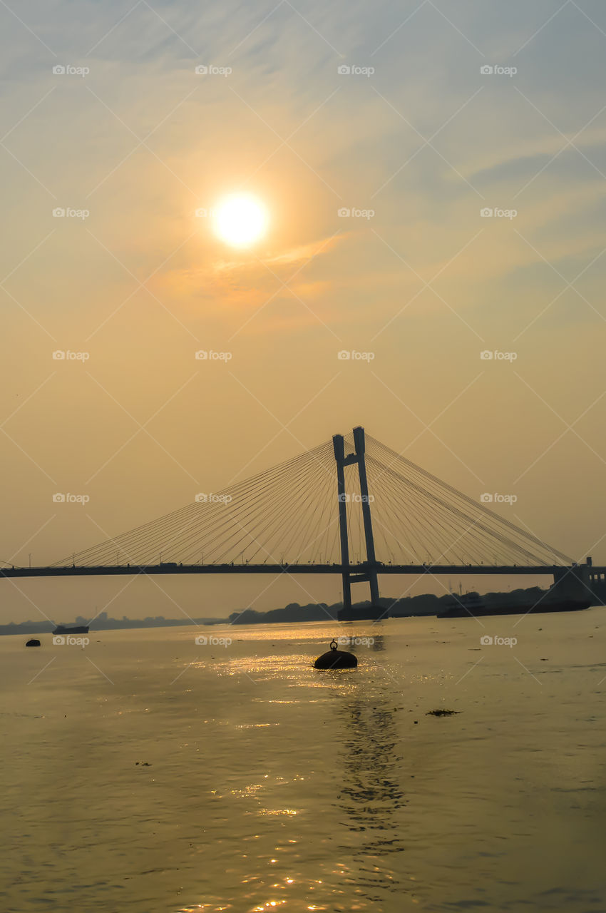 View of second Hooghly Bridge Kolkata India taken at dusk, at dawn, at daytime in landscape style. The Subject of the image is, inspiration, exciting, hopeful, bright, sensational, tranquil, calm, stunning may used as a background wallpaper screen sa