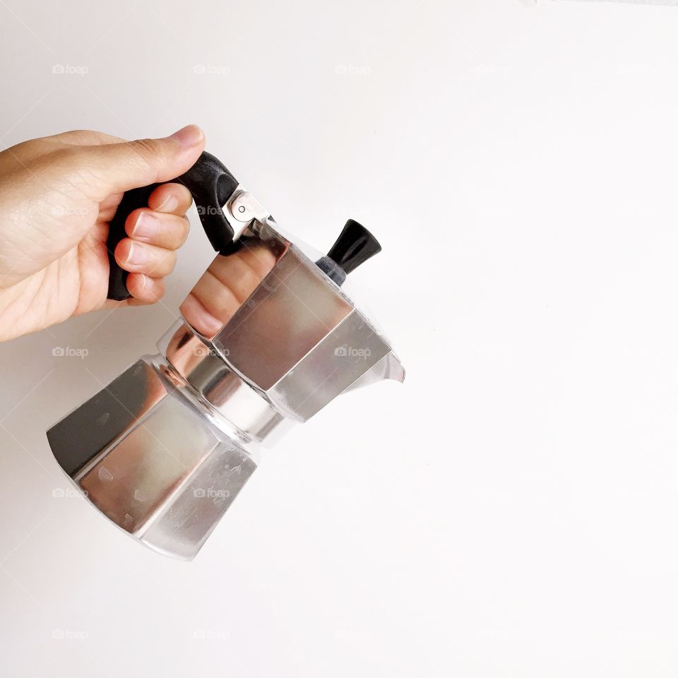 Espresso Pot. Espresso pot in hand on white. 