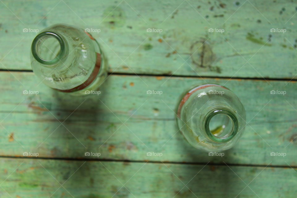 bottles of Coca cola on a wooden table