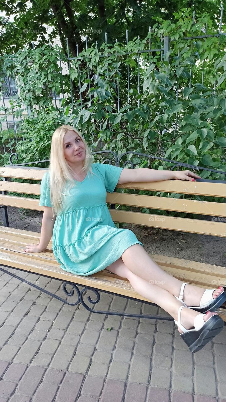 girl resting on a bench