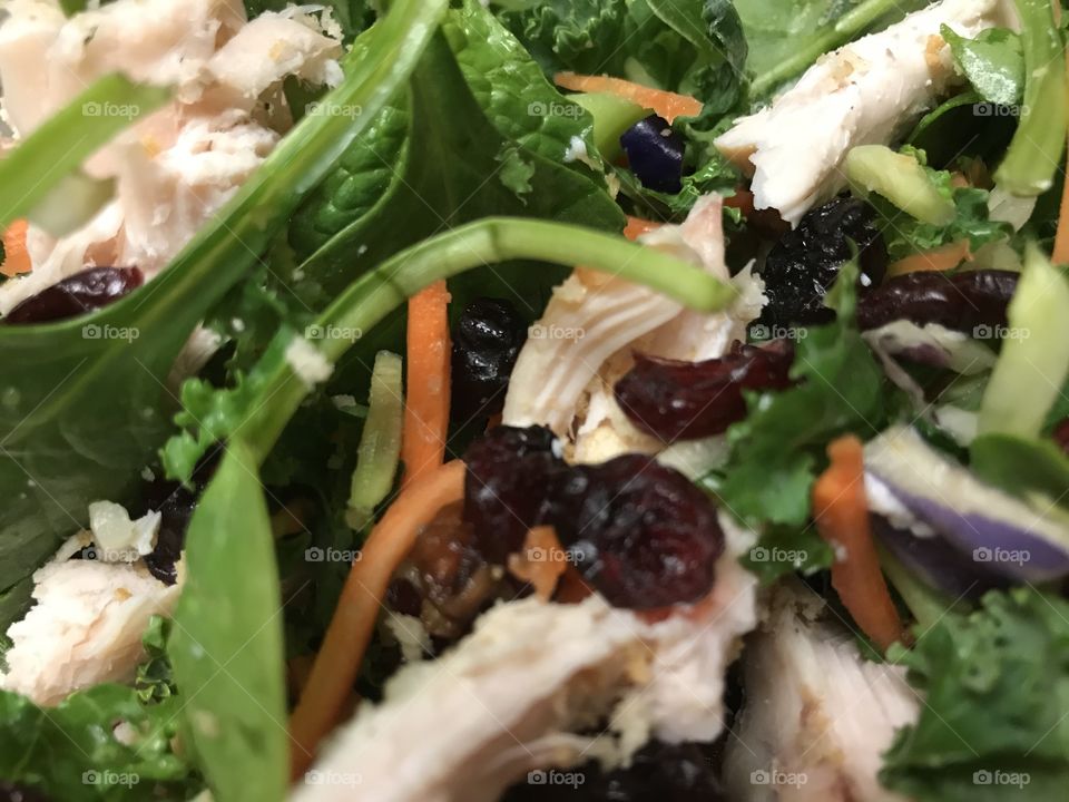 Cranberries, pecans, and chicken in a salad.