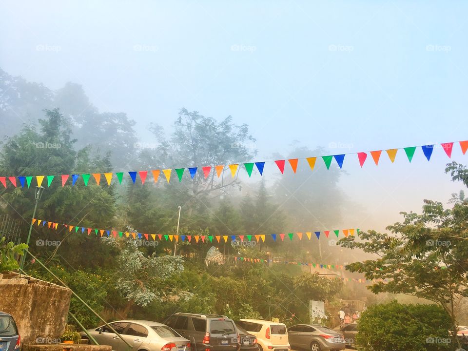 Colourful flags on a foggy day