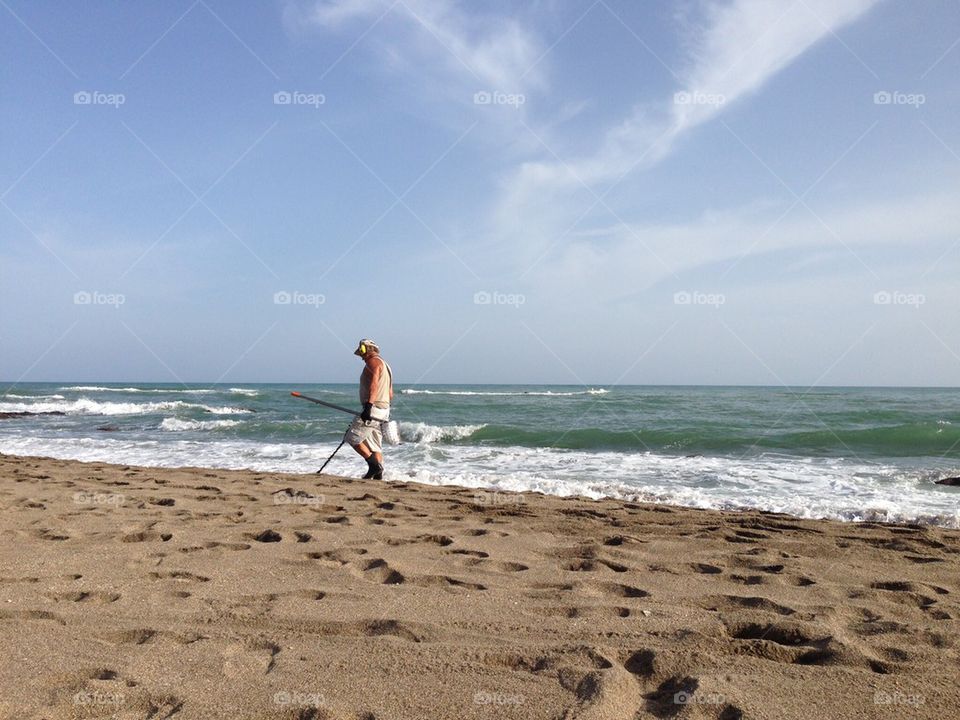 Metal detecting on the beach