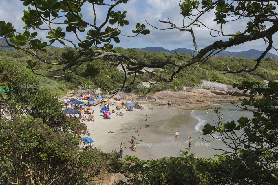 Tourists enjoy the summer on the little beach in Barra da Lagoa in Florianopolis Santa Catarina Brazil.