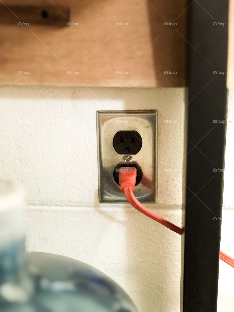 Red cord into an electrical socket