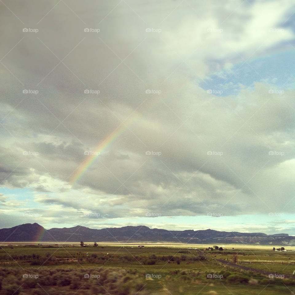 utah landscape clouds rainbow by comstock