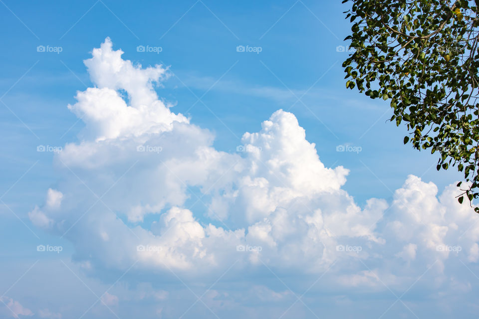 The beauty of the sky with clouds and the sun.