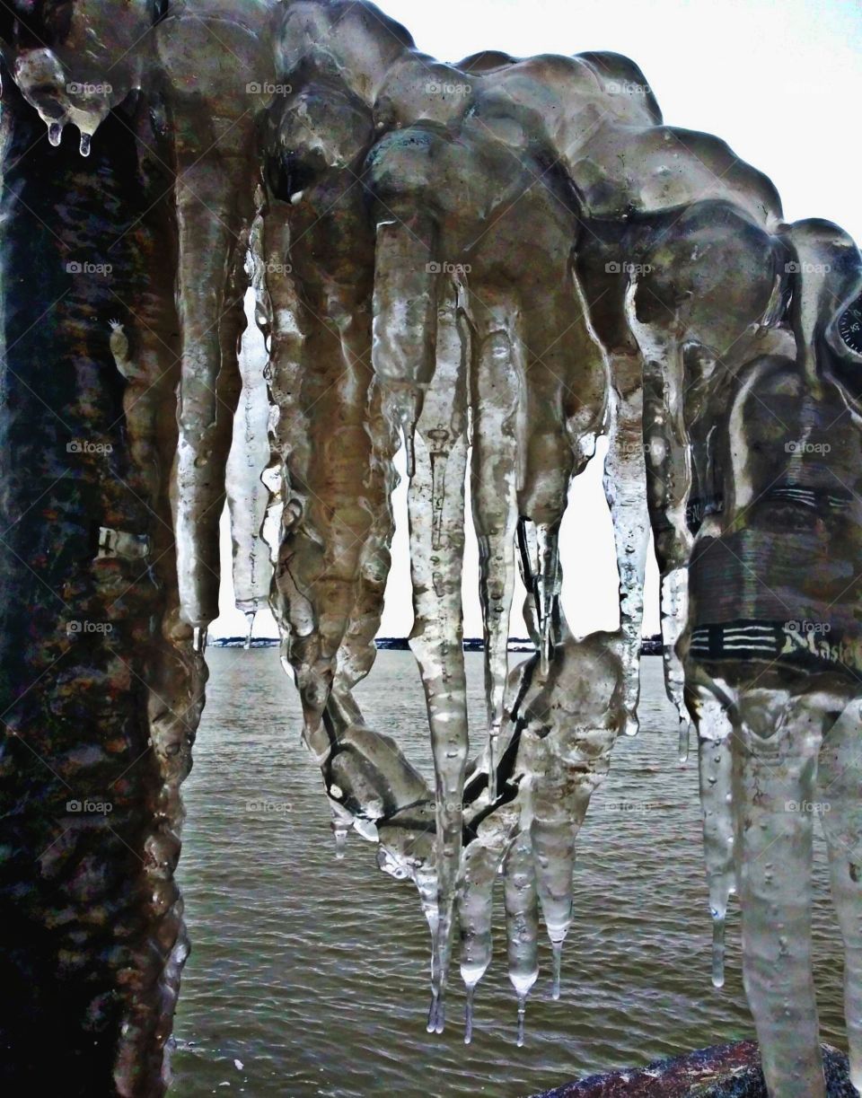 The view of melting ice holds the love locks together off the calm Lake Michigan. Photographer: Lee La Beez of Beez Lee Art