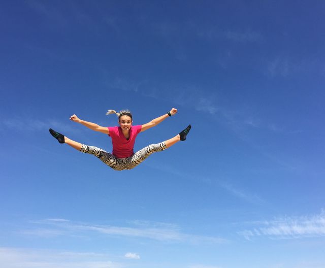 Flying Girl. Girl bouncing in trampoline