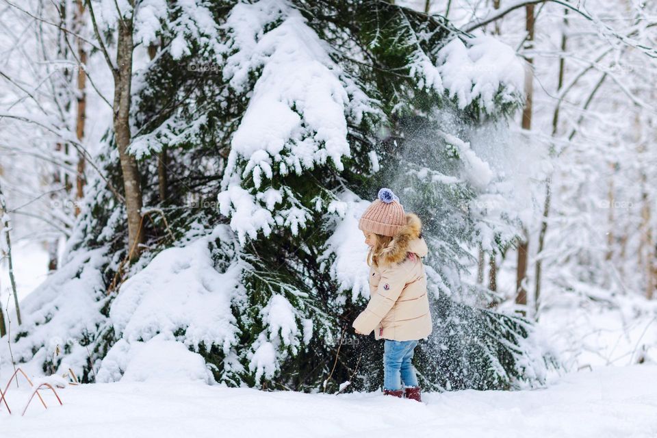 Kid having fun at winter 