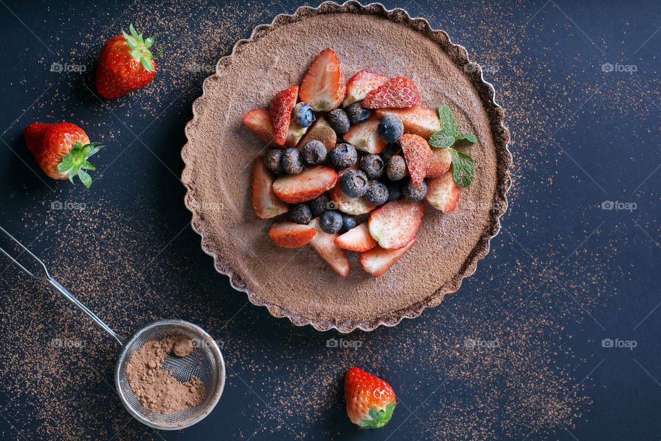 Messy mixed berry chocolate tart in the making.