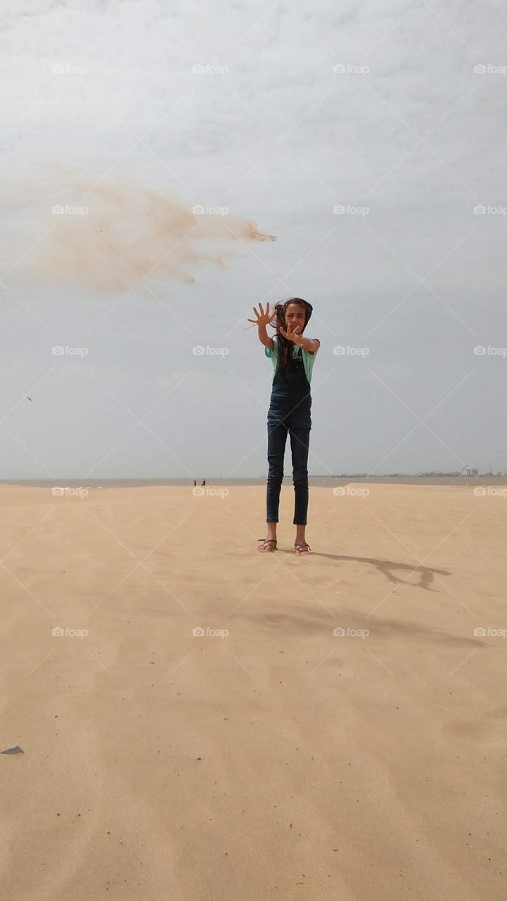 Lone  girl on sand.