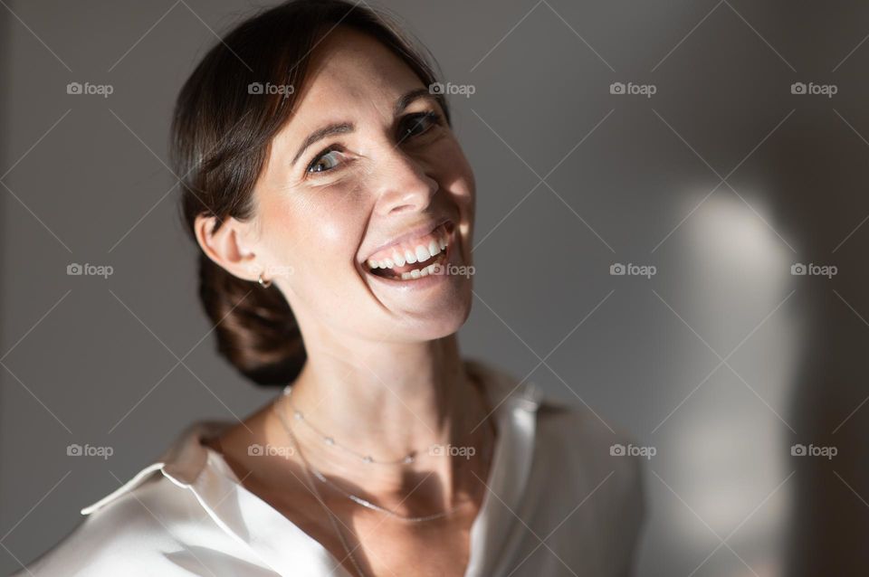 Happy woman laugh and looking at camera