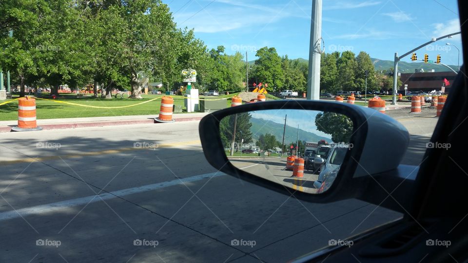 construction from a car window and mirror reflection