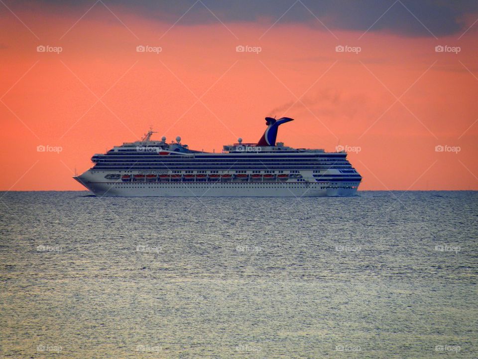 Cruise Ship Sunset. Leaving at sunset from the port of Cozumel Mexico