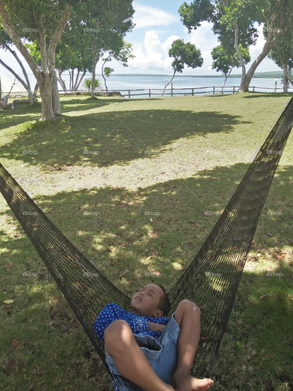 lying on the hammock  on the beach