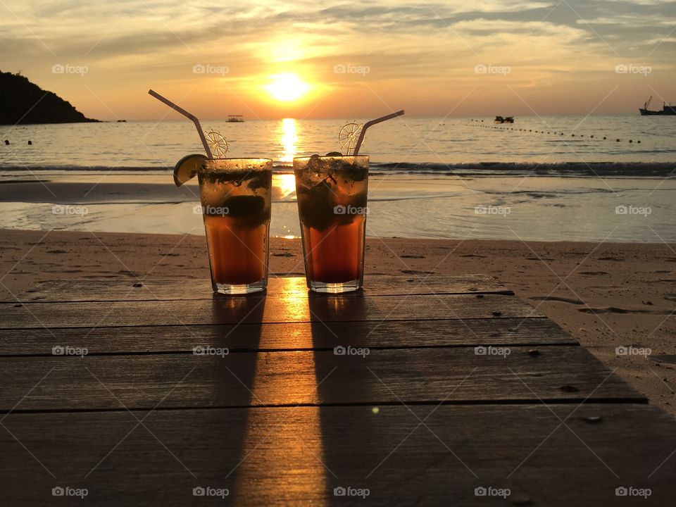 Sunset couple, with mojito ,Ao Prao, Koh Samet, Gulf of Thailand 
