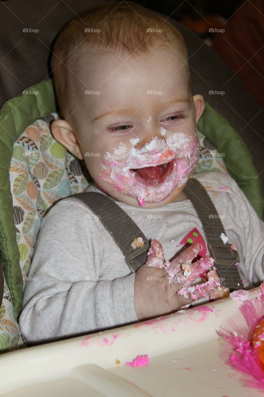 birthday baby. noelle celebrates her first birthday by getting messy with some cake