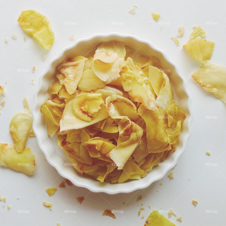 Crunchy potato chips in bowl
