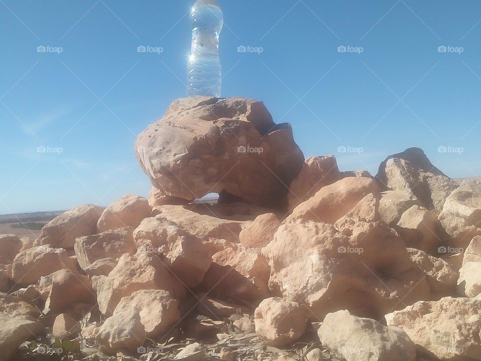 Beautiful bottle on rocks