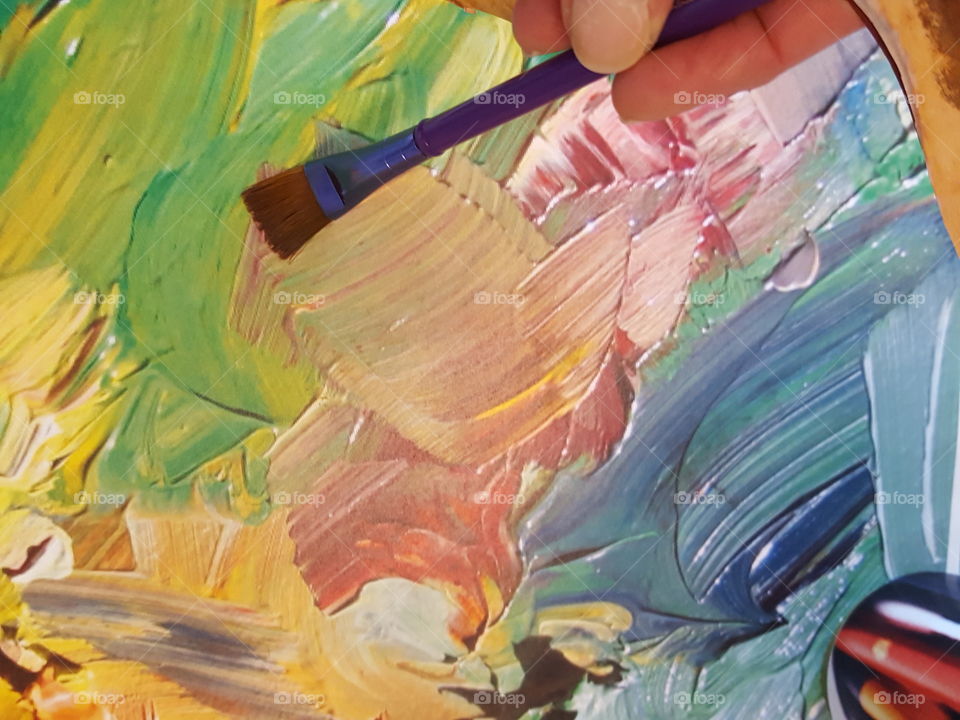 A person painting with paintbrush