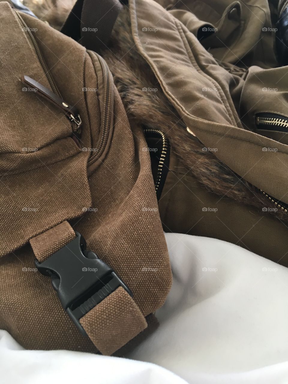 Brown bag and fur lined jacket close up