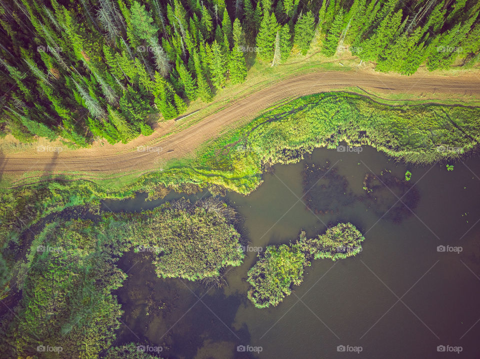 Aerial view of countryside landscape with river and forest