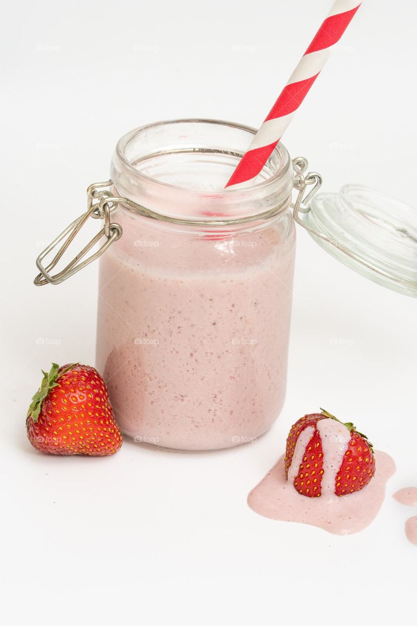 Studio photo of strawberry smoothie or milkshake