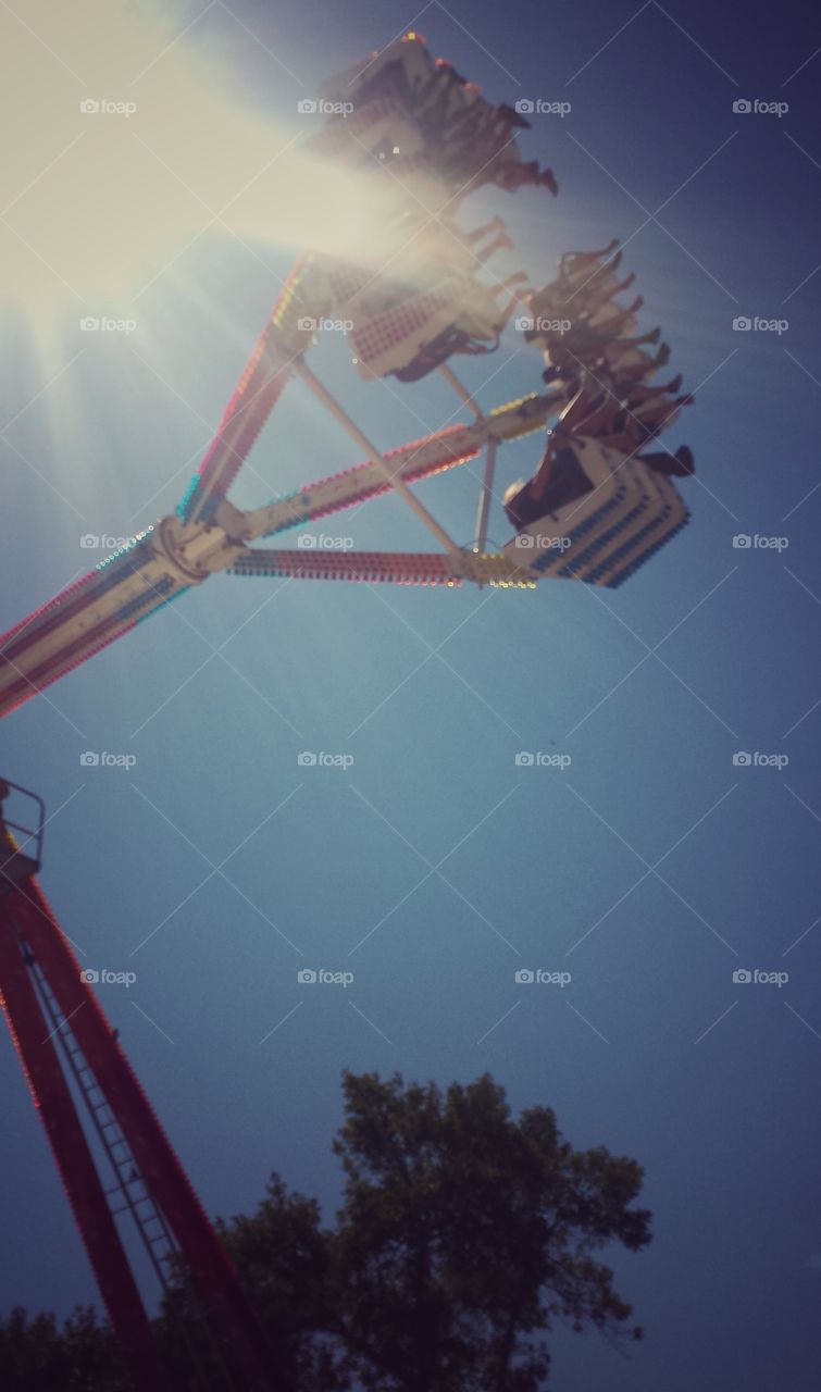 Amusement Park Rides. Thrill Seekers in Flight