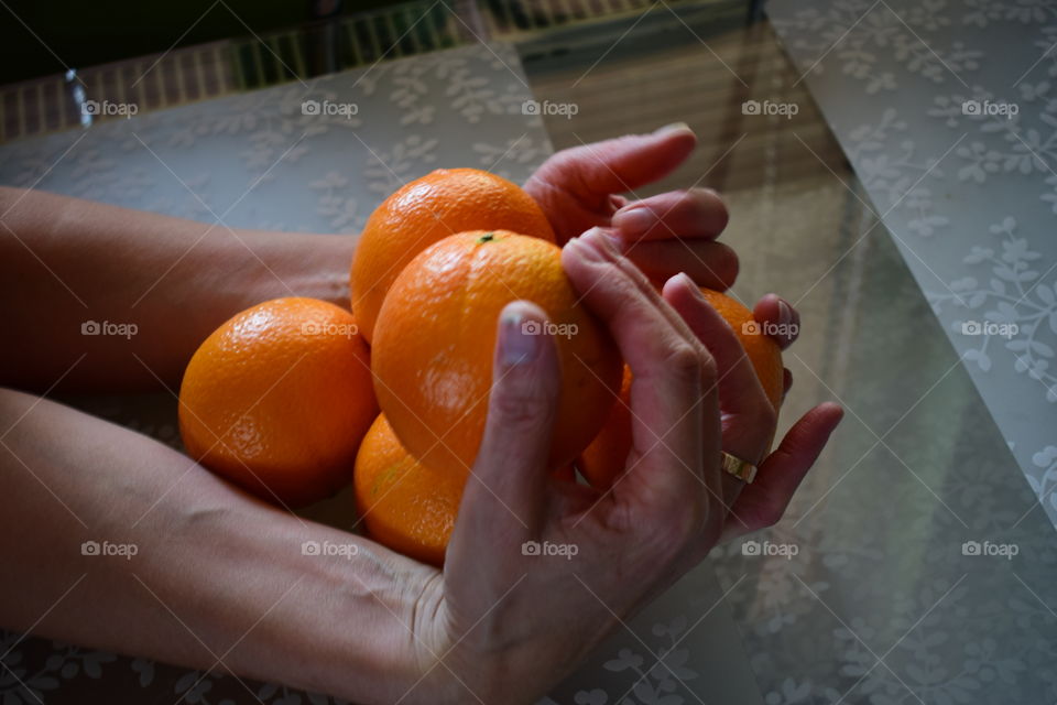 Orange , hand ,fruit