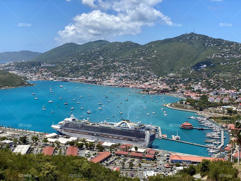 View from the top of a mountain overlooking the harbor and a cruise ship at Charlotte Amalie St Thomas