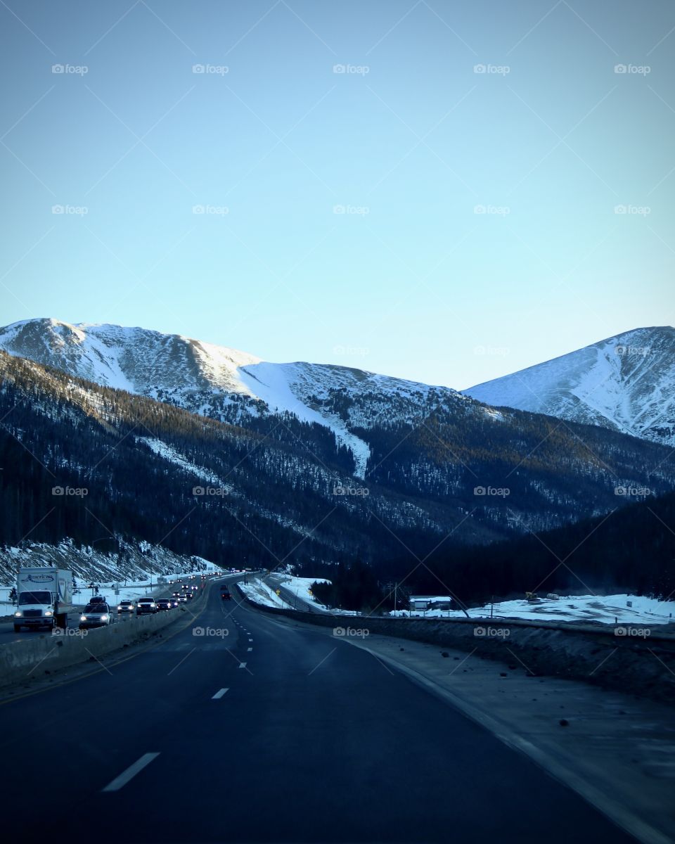 Traveling through the snow covered mountains.