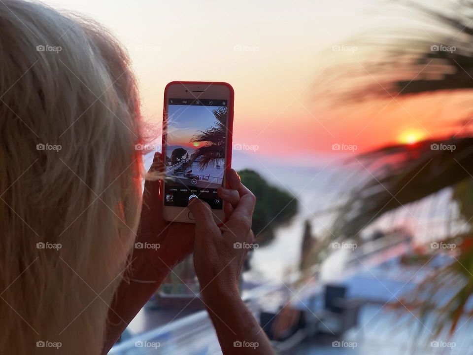 Taking a photo of sunset 