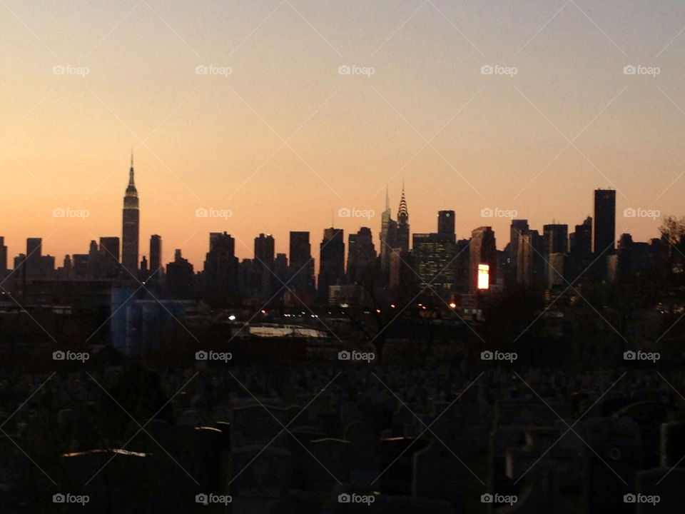 queens ny cemetery manhattan skyline by nyberskan