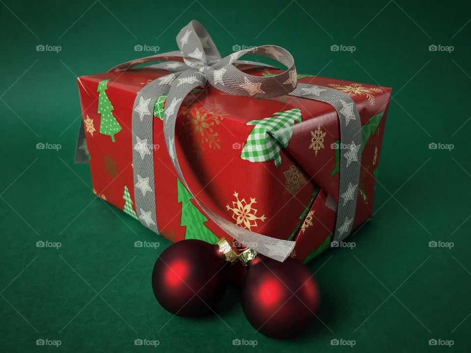 Christmas gift over green background