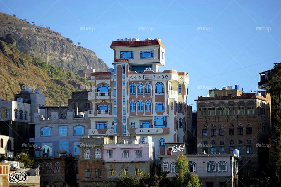 A stunning view of green mountains covered in fog in Yemen