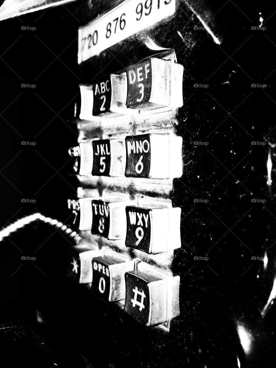 Pay phone key pad at night. 