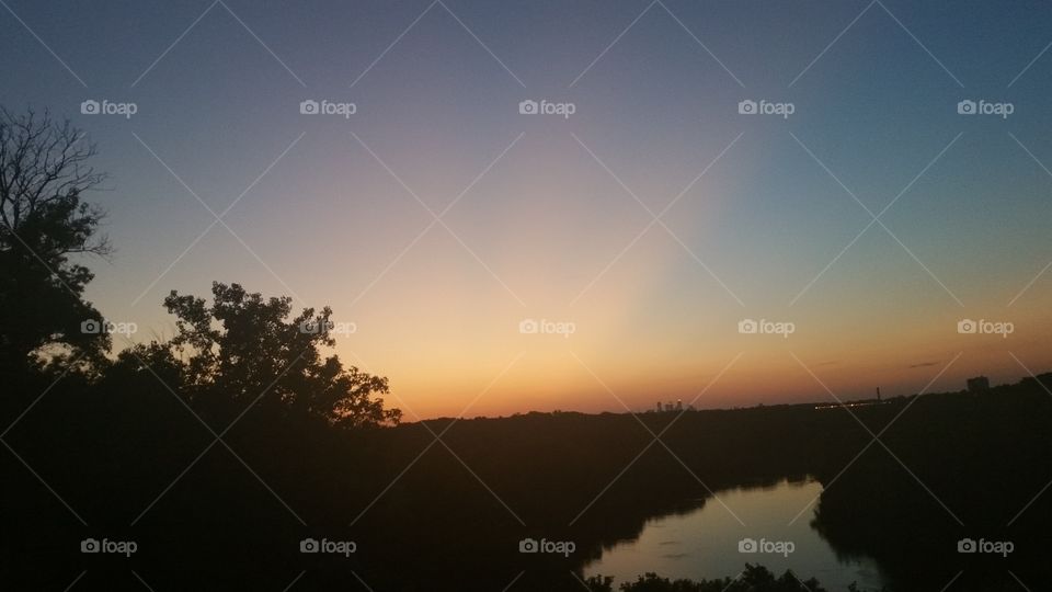 Sunset Over River And Woods