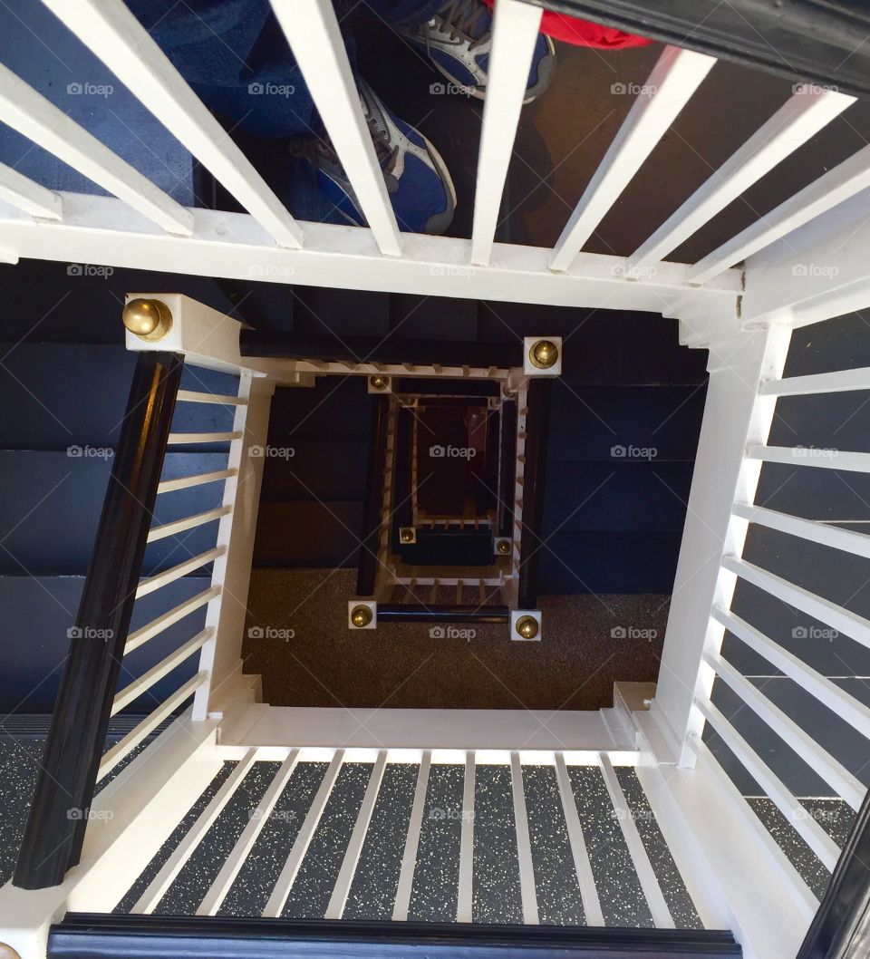 Standing on the top floor looking down a stair well