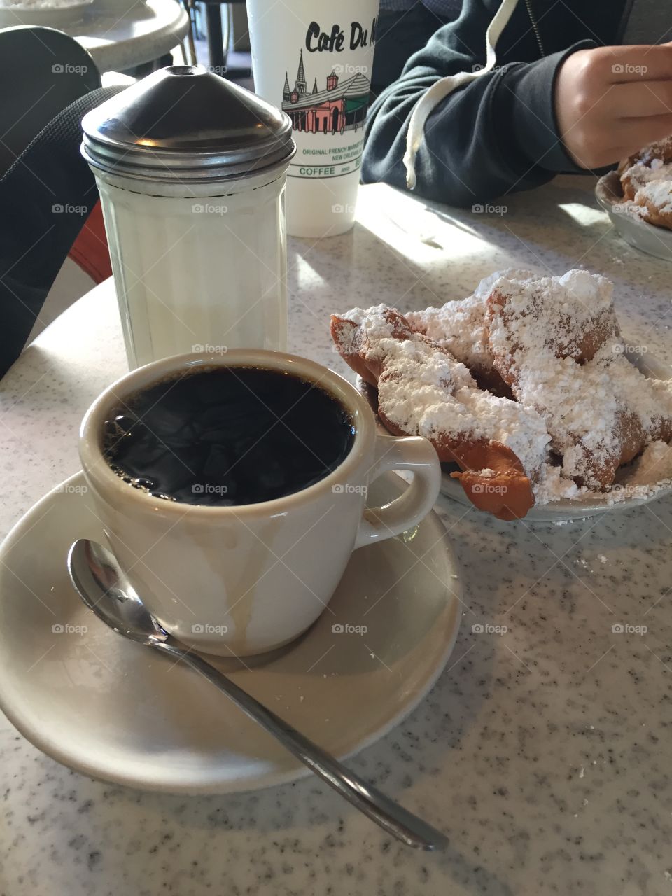 Coffee and beignets at Cafe Du Monde. 