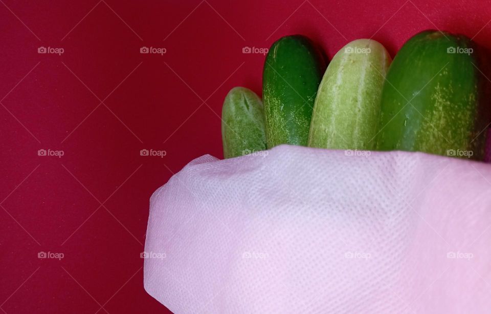 Cucumbers in pink shoping bag