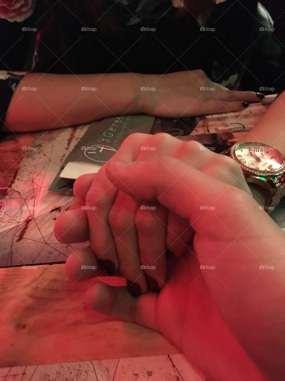 Couple holding hands