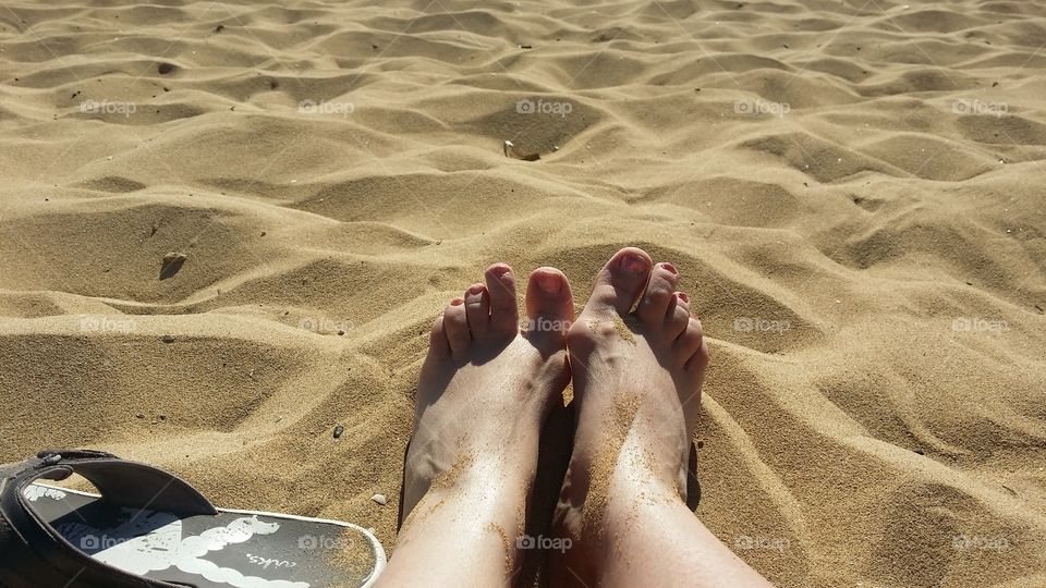 Amazing feel of warm sand on feet