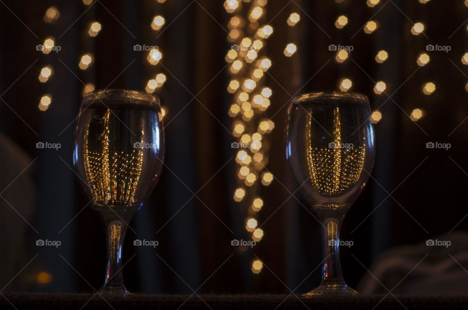 Bokeh lights through shampagne glass