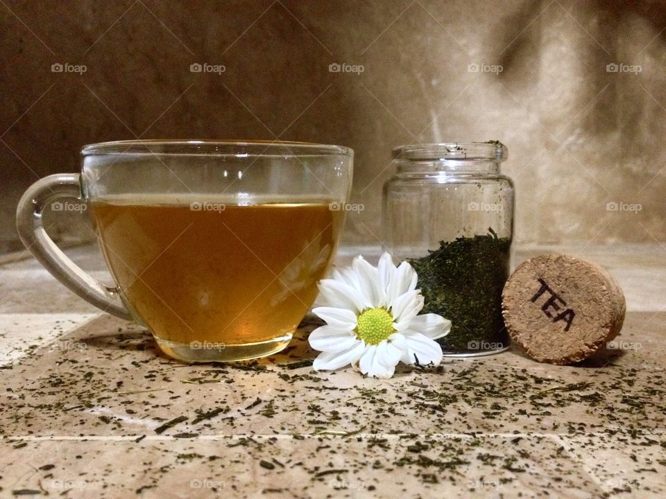 Close-up of herbal tea with daisy flower